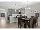 Modern kitchen with gray cabinets, white countertops, and breakfast bar at 505 Ocean Course Ave # 505, Davenport, FL 33896
