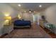 Bright Primary bedroom featuring hardwood floors and a large window at 1839 Spruce Creek Blvd, Port Orange, FL 32128
