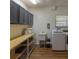 Laundry room with washer, dryer, cabinets and ample storage at 1839 Spruce Creek Blvd, Port Orange, FL 32128