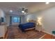 Spacious Primary bedroom with ample natural light and hardwood floors at 1839 Spruce Creek Blvd, Port Orange, FL 32128