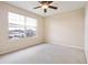 Bedroom with carpeted flooring and large window at 196 Athabasca Dr, Poinciana, FL 34759