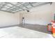 Empty garage interior with concrete floor and white walls at 196 Athabasca Dr, Poinciana, FL 34759