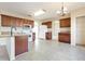 Modern kitchen with wood cabinets, granite countertops, and stainless steel appliances at 196 Athabasca Dr, Poinciana, FL 34759