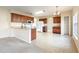Spacious kitchen with an island, breakfast bar, and ample cabinet space at 196 Athabasca Dr, Poinciana, FL 34759