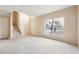 Open living room with stairs and neutral-toned carpet at 196 Athabasca Dr, Poinciana, FL 34759