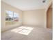 Bright and spacious living room with large windows and neutral-colored carpet at 196 Athabasca Dr, Poinciana, FL 34759