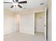 Main bedroom featuring carpeting and a walk-in closet at 196 Athabasca Dr, Poinciana, FL 34759
