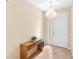 Bright entryway with a modern chandelier and wooden console table at 509 W Victoria Trails Blvd, Deland, FL 32724