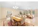 Open concept dining area with adjacent living room and kitchen views at 509 W Victoria Trails Blvd, Deland, FL 32724