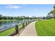 Scenic walking path alongside a lake in a tranquil community setting at 509 W Victoria Trails Blvd, Deland, FL 32724