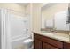 Clean bathroom with tub, shower, and granite vanity at 509 W Victoria Trails Blvd, Deland, FL 32724