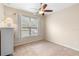 Spacious bedroom with window, ceiling fan, and dresser at 509 W Victoria Trails Blvd, Deland, FL 32724