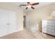 Bright bedroom with double door closet and ceiling fan at 509 W Victoria Trails Blvd, Deland, FL 32724