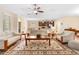 Open concept living room with views of kitchen and dining area at 509 W Victoria Trails Blvd, Deland, FL 32724