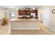 Open concept kitchen with island and stainless steel appliances at 509 W Victoria Trails Blvd, Deland, FL 32724