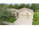 Three-car garage and attractive landscaping at 509 W Victoria Trails Blvd, Deland, FL 32724