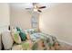 Guest bedroom with twin beds and ceiling fan at 509 W Victoria Trails Blvd, Deland, FL 32724