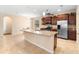 Kitchen with granite countertops, stainless steel appliances and an island at 509 W Victoria Trails Blvd, Deland, FL 32724