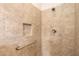Walk-in shower with neutral tile and grab bar at 509 W Victoria Trails Blvd, Deland, FL 32724