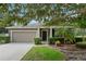 One-story house with attached garage and landscaping at 968 Springs Landing Dr, Deltona, FL 32725