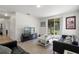 Living area with comfy seating, large TV, and patio access at 968 Springs Landing Dr, Deltona, FL 32725