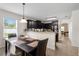 Kitchen boasts dark cabinetry, granite counters, and breakfast bar at 968 Springs Landing Dr, Deltona, FL 32725