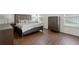 Main bedroom with plush bed, wood floors, and ample closet space at 968 Springs Landing Dr, Deltona, FL 32725