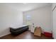 Simple bedroom with a twin bed, nightstand, and wood floors at 968 Springs Landing Dr, Deltona, FL 32725