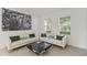 Living room features white couches, coffee table, and large artwork at 968 Springs Landing Dr, Deltona, FL 32725