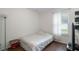 Bright bedroom featuring a full-size bed and wood flooring at 968 Springs Landing Dr, Deltona, FL 32725