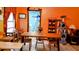 Cozy dining area with a wooden table and chairs,cat tree, and shelving at 24008 Ermine Rd, Astor, FL 32102