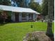 Cute single story home with metal roof and yard at 24008 Ermine Rd, Astor, FL 32102