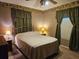 Bright bedroom with a double bed, nightstands, and ample closet space at 24008 Ermine Rd, Astor, FL 32102