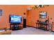 Living room featuring a large TV, entertainment center, and comfortable seating at 24008 Ermine Rd, Astor, FL 32102