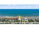 Aerial view of beachfront home with ocean and neighborhood at 717 Ocean Shore Blvd, Ormond Beach, FL 32176