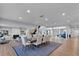 Open concept dining room with wooden table and access to the living room at 717 Ocean Shore Blvd, Ormond Beach, FL 32176