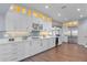 Large kitchen with white cabinetry, quartz countertops, and ample storage at 717 Ocean Shore Blvd, Ormond Beach, FL 32176