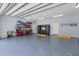 Organized garage with ample storage and work bench at 717 Ocean Shore Blvd, Ormond Beach, FL 32176