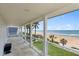 Covered porch overlooking the beach and ocean at 717 Ocean Shore Blvd, Ormond Beach, FL 32176