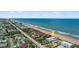 Aerial view highlighting beachfront home and surroundings at 717 Ocean Shore Blvd, Ormond Beach, FL 32176