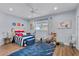 Nautical-themed bedroom with hardwood floors and ample natural light at 717 Ocean Shore Blvd, Ormond Beach, FL 32176