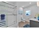 Bathroom with a shower/tub combo and grey vanity at 717 Ocean Shore Blvd, Ormond Beach, FL 32176