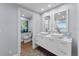 Double vanity and separate toilet in a modern bathroom at 717 Ocean Shore Blvd, Ormond Beach, FL 32176