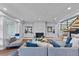 Living room with gray sectional sofa and modern fireplace at 717 Ocean Shore Blvd, Ormond Beach, FL 32176