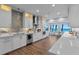 Open concept kitchen boasting white cabinets and stainless steel appliances at 717 Ocean Shore Blvd, Ormond Beach, FL 32176