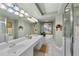 Double vanity bathroom with a soaking tub and shower at 3425 S Atlantic Ave # 1105, Daytona Beach Shores, FL 32118