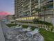 Relaxing pool deck with lounge chairs and landscaping at 3425 S Atlantic Ave # 1105, Daytona Beach Shores, FL 32118