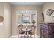 Cozy breakfast nook with small table and two chairs, near kitchen at 3425 S Atlantic Ave # 1105, Daytona Beach Shores, FL 32118