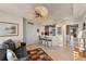 Sitting area with a small couch, bar and ceiling fan at 3425 S Atlantic Ave # 1105, Daytona Beach Shores, FL 32118