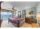 Ocean view main bedroom with a king-size bed and dresser at 3425 S Atlantic Ave # 1105, Daytona Beach Shores, FL 32118